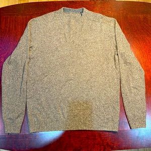 100% cashmere sweater. And.